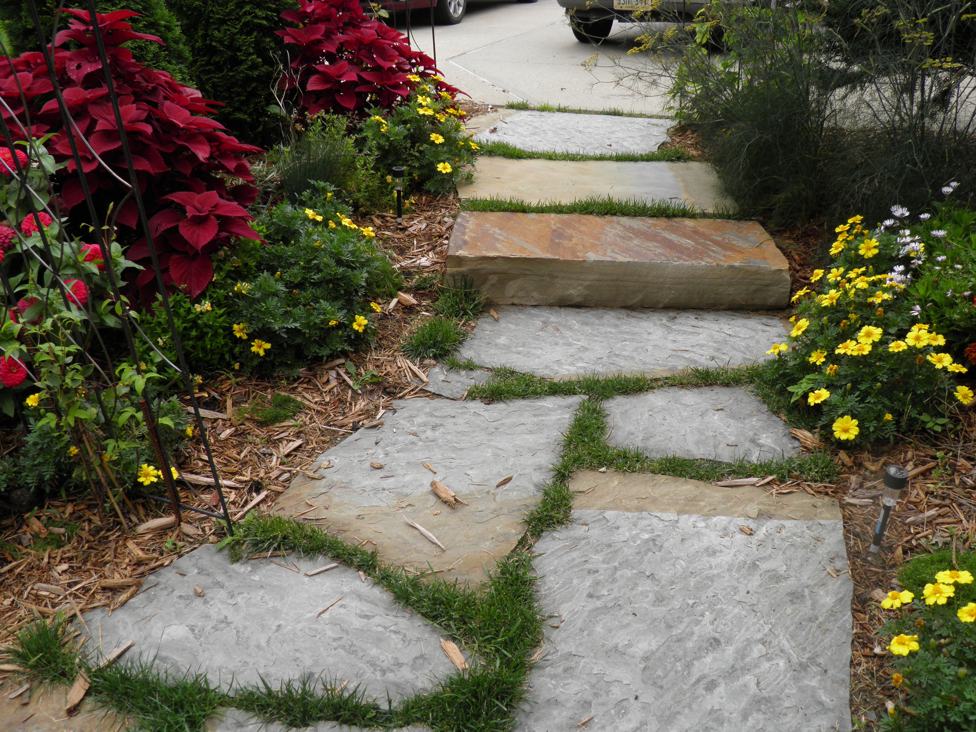 Finished landscape with lawn, beds, and hardscape complete